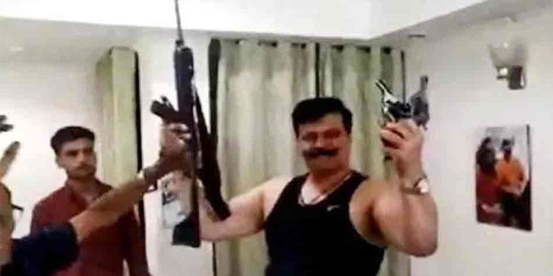 The lawmaker with guns in hands, dances to a Bollywood number