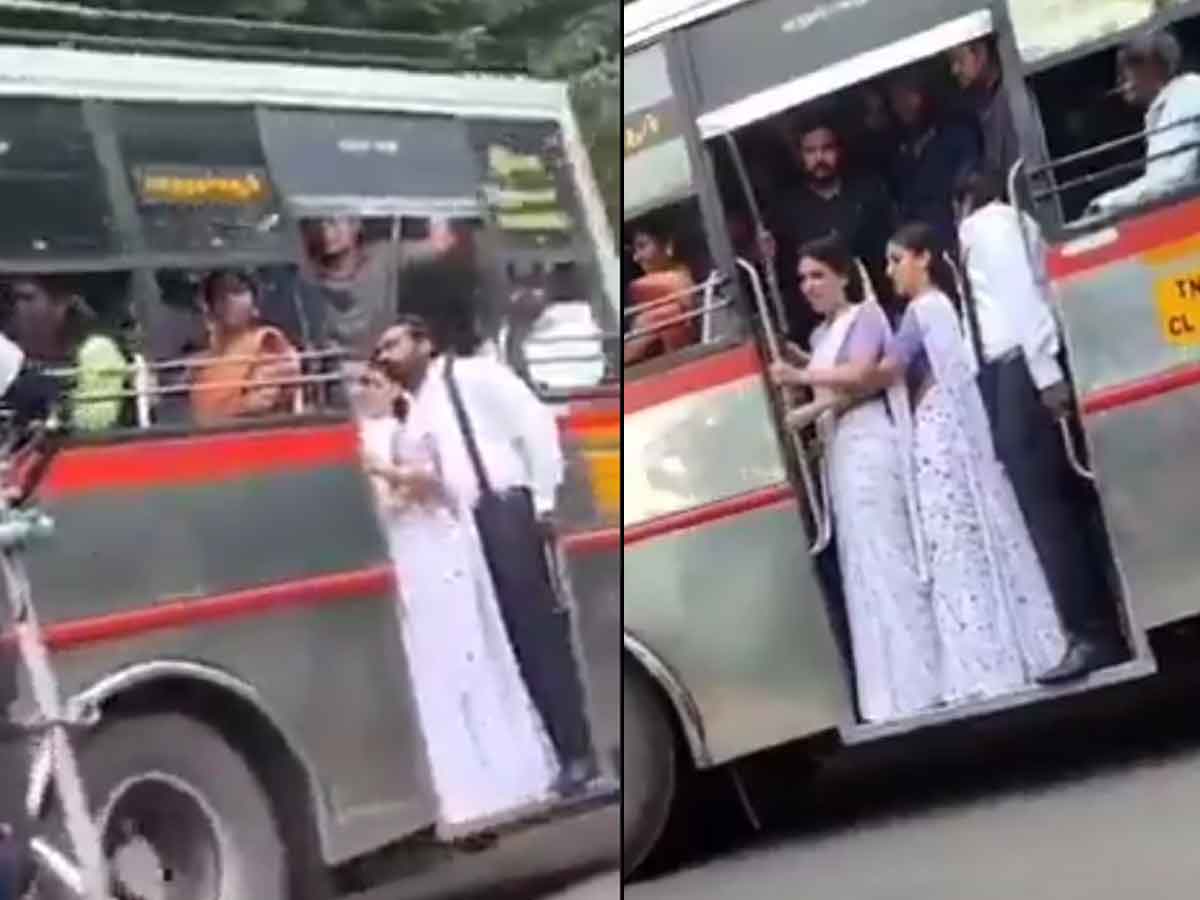 Samantha and Nayanthara standing on footboard of a bus